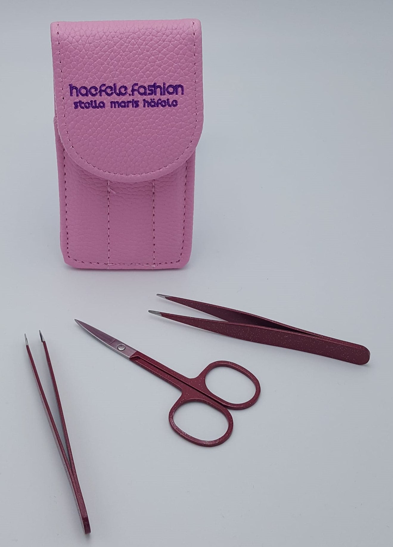 Set of two tweezers and one scissor made of professional-grade stainless steel.